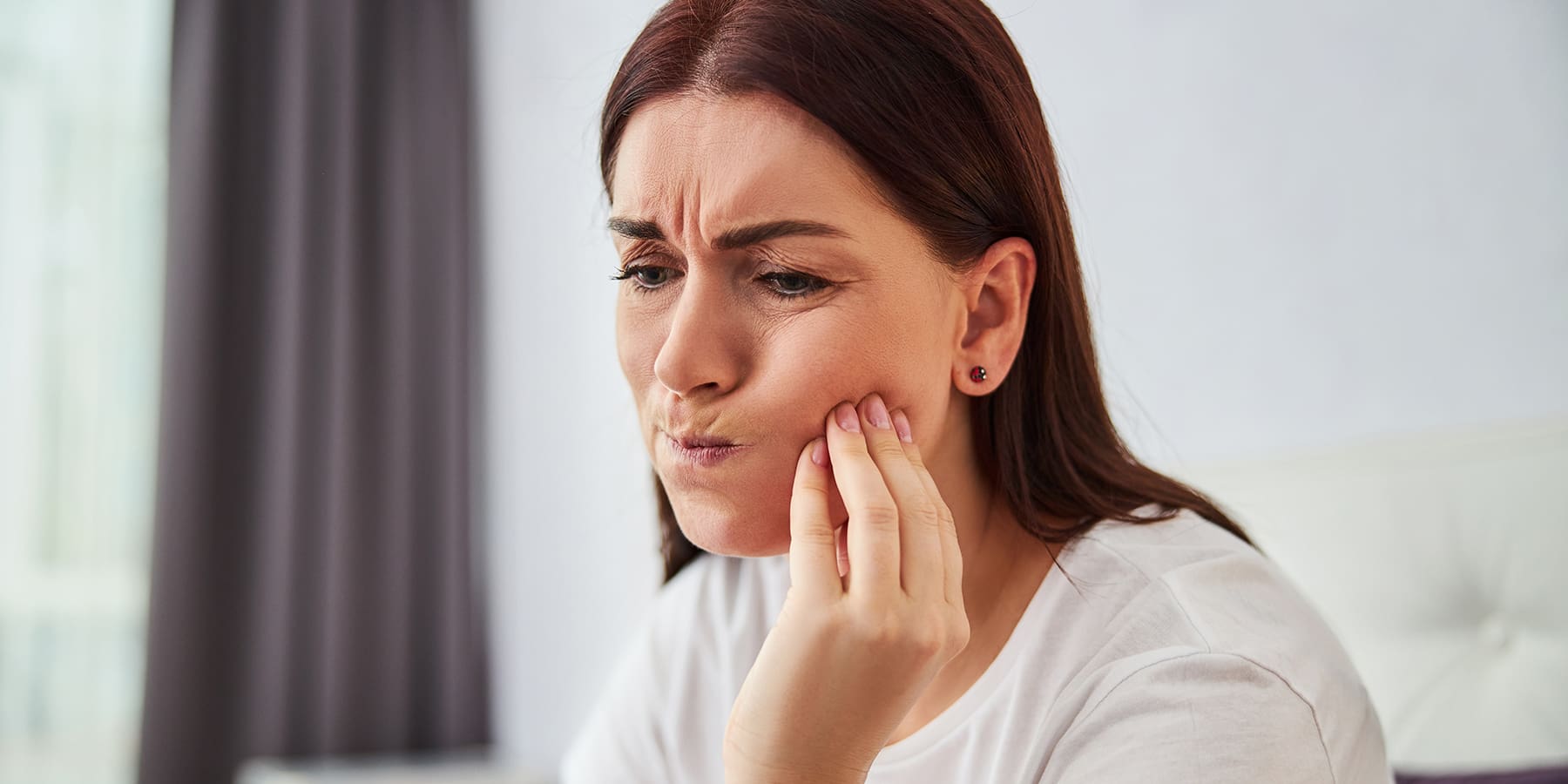 7 Reasons Why Your Teeth May Feel Loose (and When to See a Specialist)